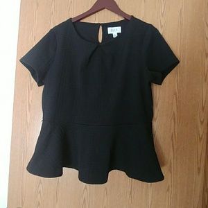 Black preplum top about to donate